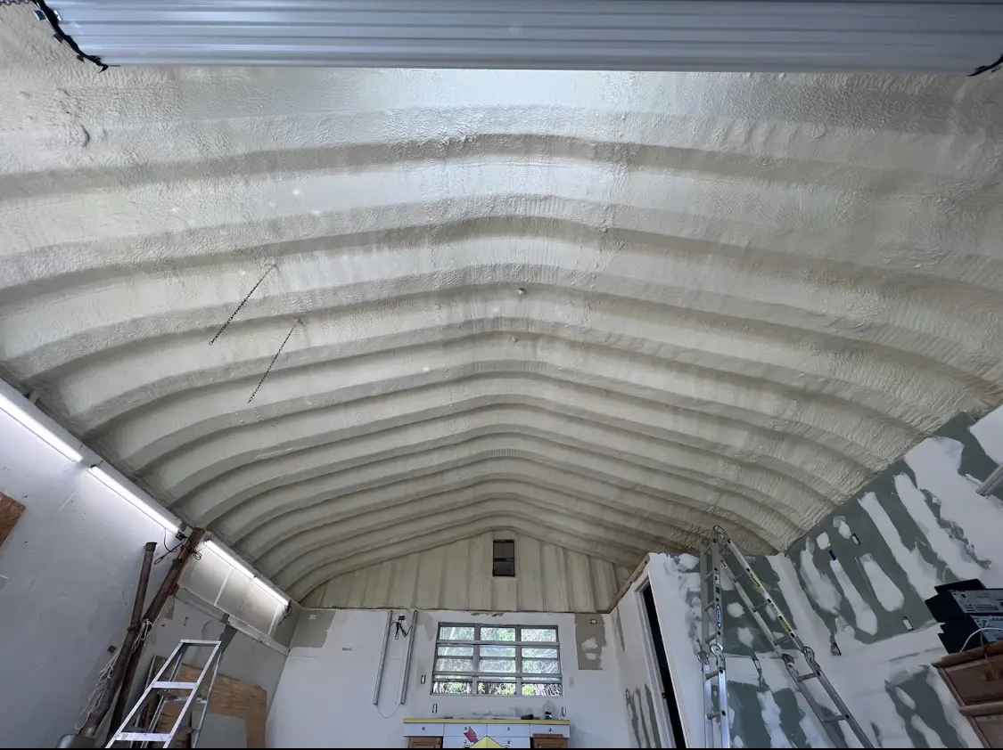 Spray polyurethane foam applied to the underside of a metal roof deck in Battle Creek